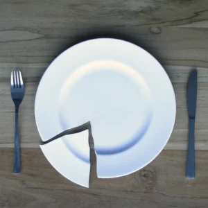 Product safety for potters - online course. Cracked plate on a table